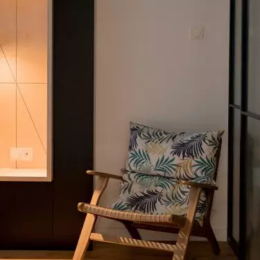 The braided chair is decorated with a cushion with an exotic pattern