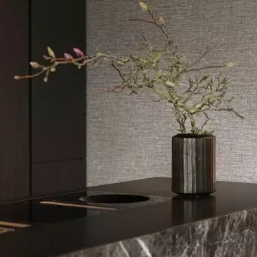 The kitchen island was made of dark marble