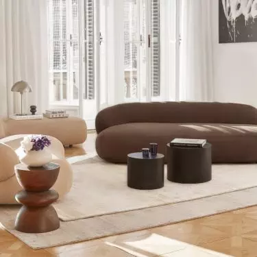 A chocolate sofa can be the focal point of an arrangement