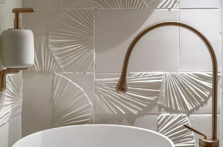 In the toilet, you'll find hand-formed leaf relief tiles