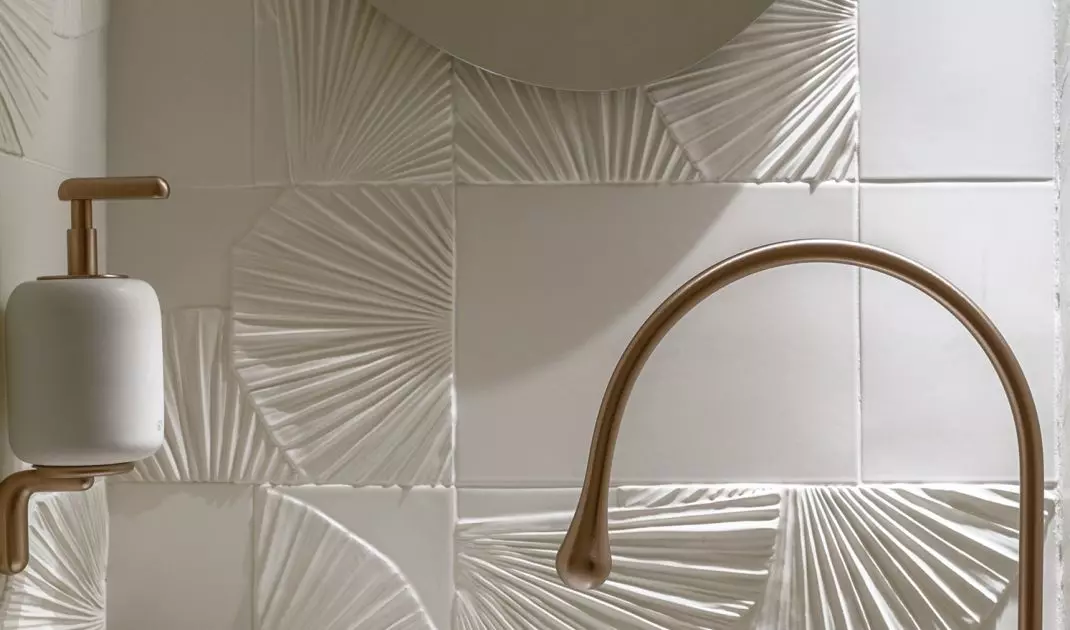 In the toilet, you'll find hand-formed leaf relief tiles