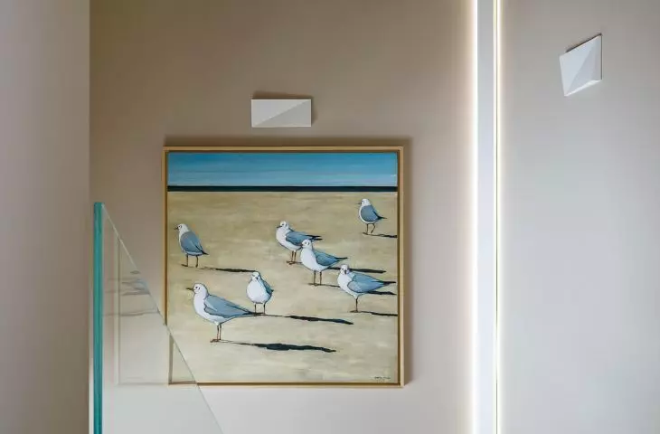 The staircase is decorated with one of the paintings