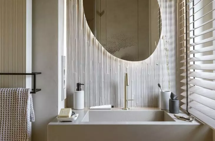 The tiles used in the bathroom resemble bamboo