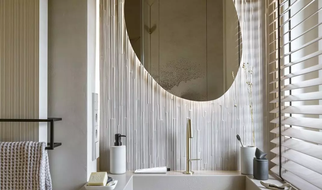 The tiles used in the bathroom resemble bamboo