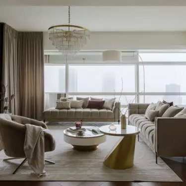 In the focal point of the living area is a striking chandelier