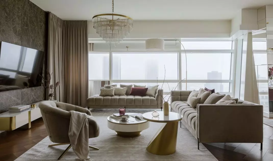 In the focal point of the living area is a striking chandelier