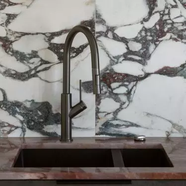 The use on the tiles combines shades of white, cream and burgundy