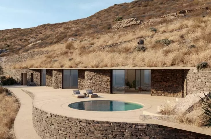 A veranda with a circular pool mimics the effect of flowing water, bringing movement and lightness to the outdoor space of Villa Rhoēs