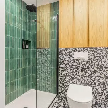 Tiles with terazzo pattern add dynamism to the interior