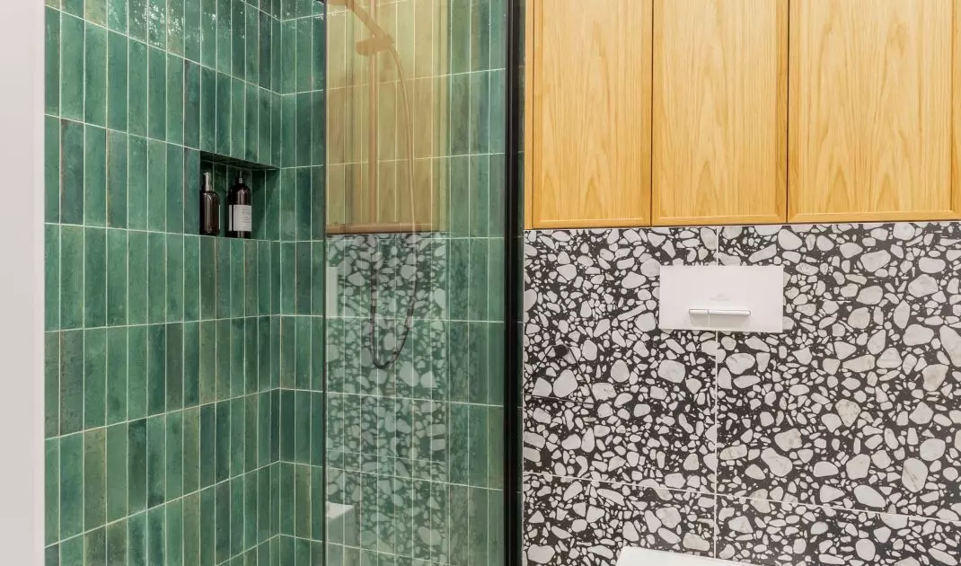 Tiles with terazzo pattern add dynamism to the interior