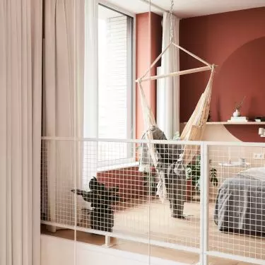 The circle on the headboard behind the bed symbolizes the sun
