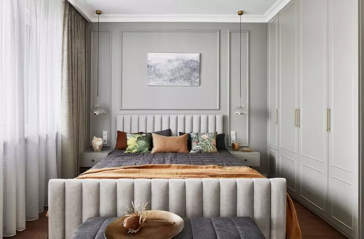 Despite its location on a mezzanine floor, the bedroom is bright and spacious