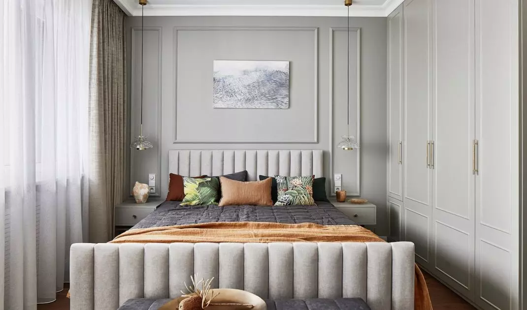 Despite its location on a mezzanine floor, the bedroom is bright and spacious