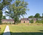 Two renovated residential buildings, combining modernity with traditional 20th-century architectural style