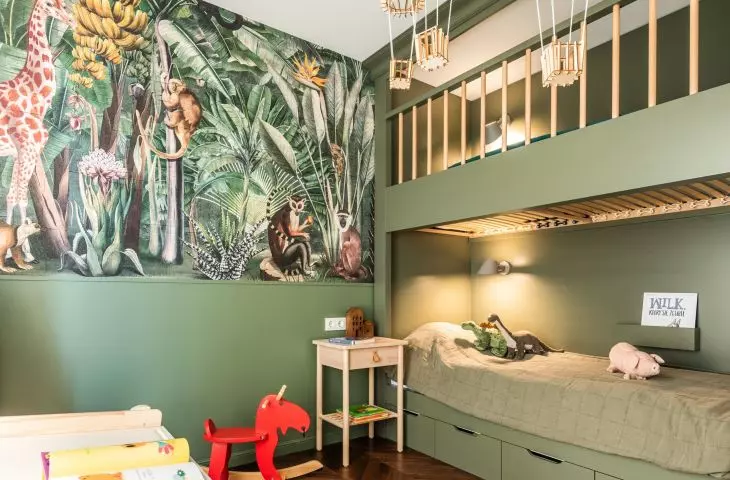 The wall of the boys' room was decorated with wallpaper with a jungle motif