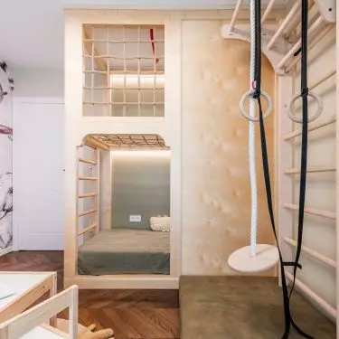 A gymnastic ladder was placed in the corner along with a climbing rope and exercise hoops