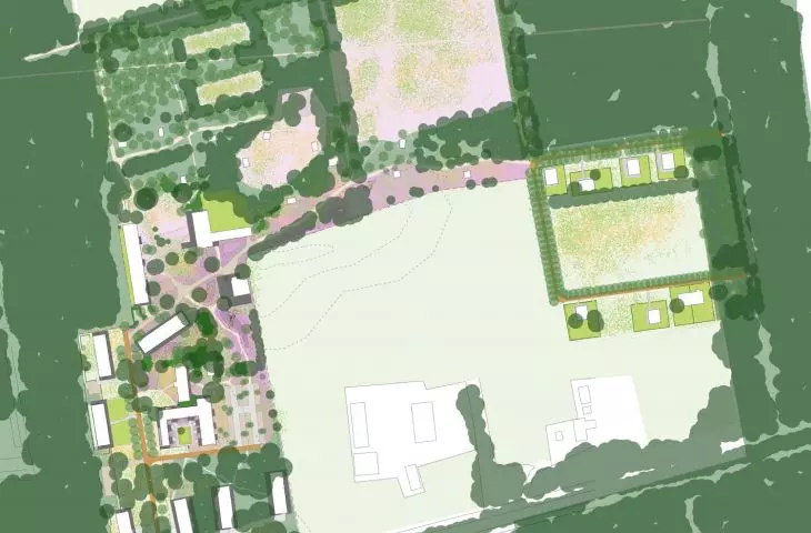Aerial view of the site plan with buildings and green areas
