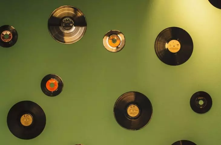 A composition of a variety of vinyl records will be an interesting wall decoration
