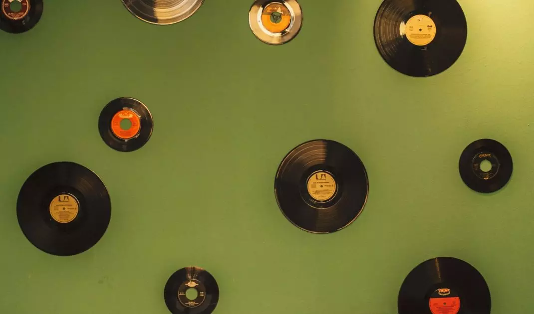 A composition of a variety of vinyl records will be an interesting wall decoration