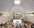 A sculptural quartz and glass staircase and a glass elevator connect different levels, and landings create multiple sightlines in Apple's The Exchange TRX space.