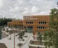 The wooden facade of Pelgulinna State Secondary School reflects the symbiosis of modern architecture with the natural surroundings of the Merimetsa forest