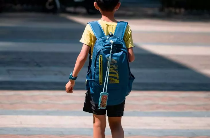Young student walking down the street