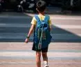 Young student walking down the street