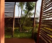 Wooden wall arcades with garden views 