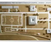 Architectural model of the campus with buildings with pyramid roofs and a soccer field