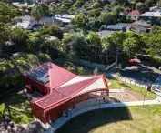 Community center in Hurlstone Park has flat roof in red and white colors