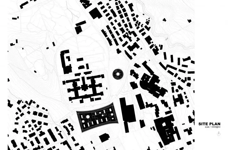 Site plan showing a complex urban layout with buildings, roads and site contours