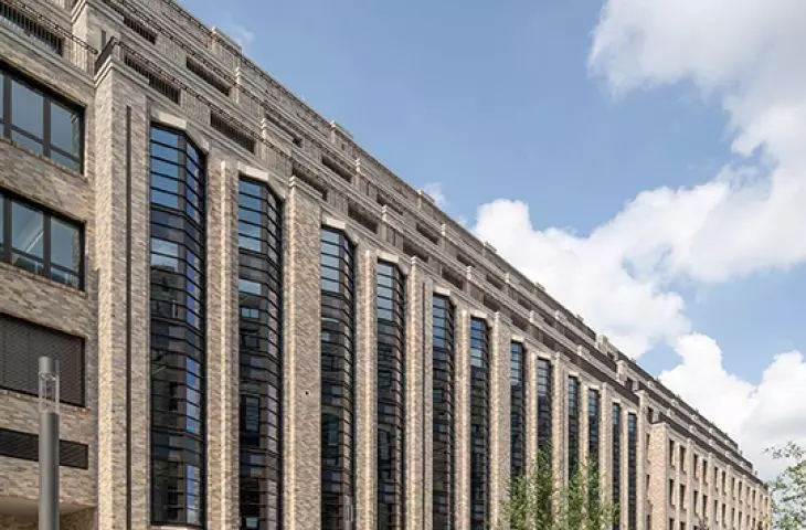 A fragment of a modern building with tall, narrow windows