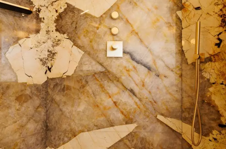 Intriguing quartzite fluting adds a luxurious touch to the space