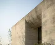 Ginkgo Gallery is enclosed on the south side and has curved roofs 