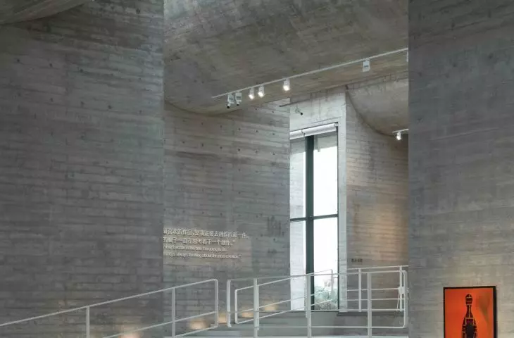 The interior of Ginkgo Gallery features raw concrete walls and thoughtful lighting 