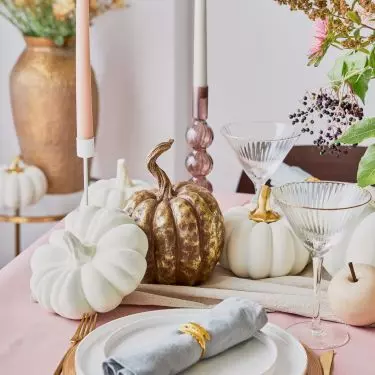 Gold accessories blend beautifully behind natural fabrics