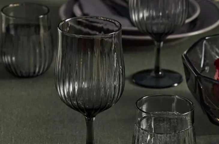 Glasses and goblets in muted shades of graphite go beautifully with dark plates and textiles in similar tones