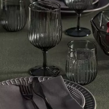 Glasses and goblets in muted shades of graphite go beautifully with dark plates and textiles in similar tones