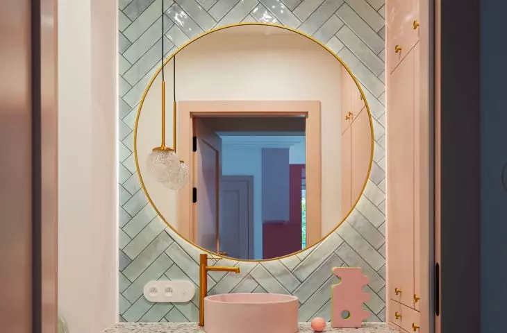 A litter box for the cat was placed in the bathroom cabinet
