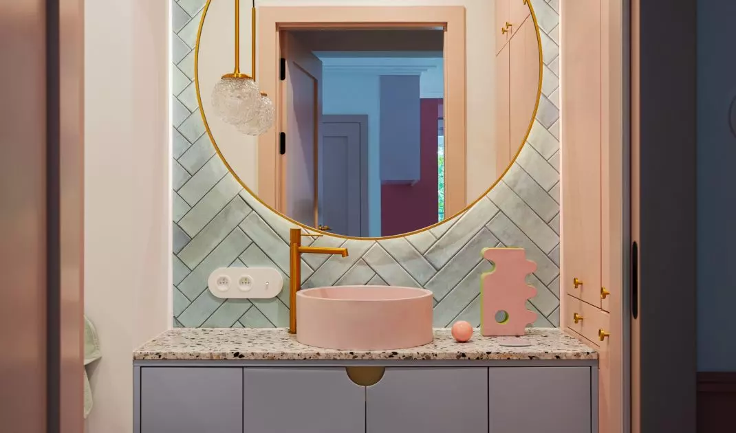 A litter box for the cat was placed in the bathroom cabinet