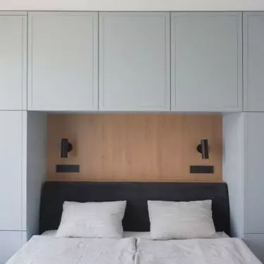 The space above the bed has been developed into a storage area
