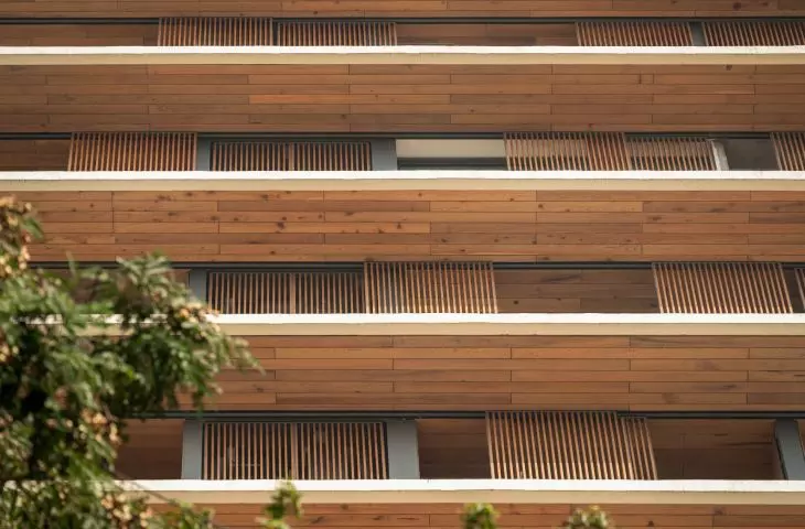 The deep white canopies, called chhajjas, protect residents of the Carmichael high-rise residential building from the sun and rain, combining aesthetics with functionality in a tropical climate.