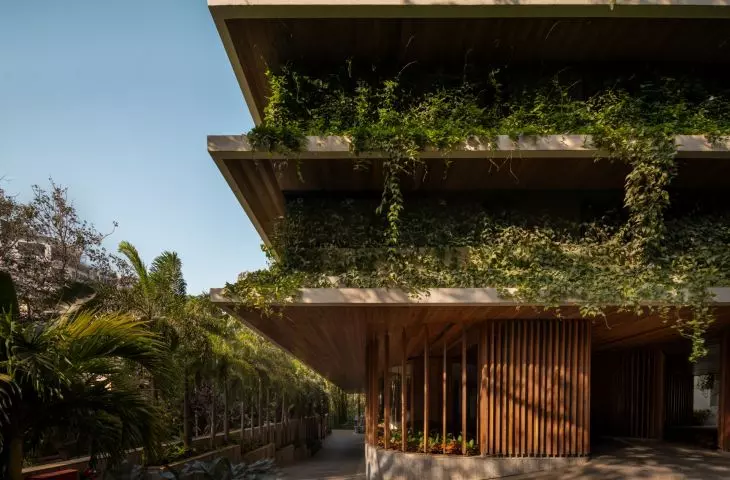 A view of the lower floors of the Carmichael residential tower shows how greenery intertwines with architecture