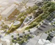  Aerial view of modern city park with paths, greenery , surrounded by city buildings