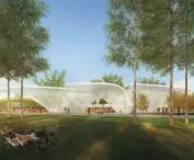 Park z drzewami, zielonym trawnikiem i nowoczesnymi białymi konstrukcjami