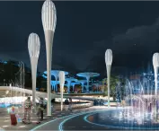 Modern park at night with modern illuminated structures, fountains, greenery and paths