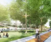 A scene in a park with trees, people and a winding footbridge 