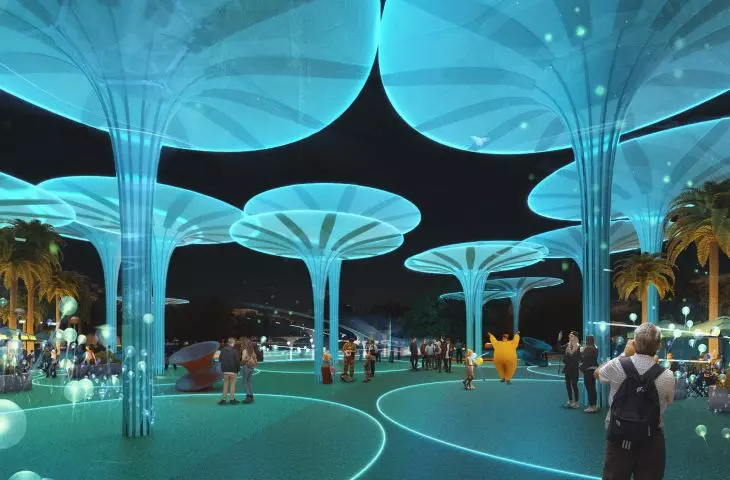 Futuristic outdoor space with glowing blue artificial trees at night and people interacting