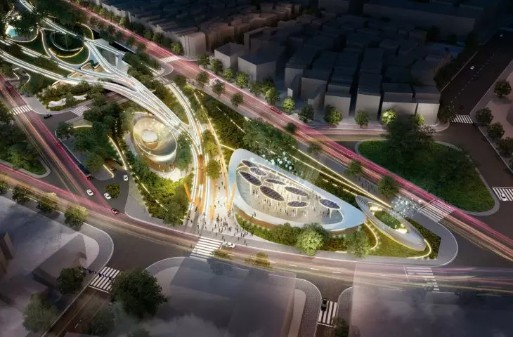 Widok z lotu ptaka na nowoczesny park miejski nocą z oświetlonymi ścieżkami i unikalnymi owalnymi strukturami