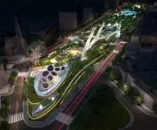 Widok z lotu ptaka nocą na nowoczesny park z nowoczesnymi, podświetlanymi konstrukcjami, zielenią i ścieżkami